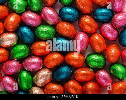 Colorful Easter eggs background. Chocolate Easter eggs texture. Top view Stock Photo
