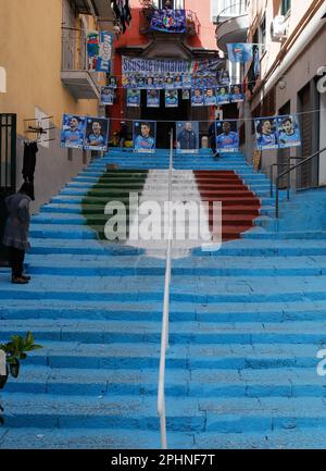 Naples, Italy. 29th Mar, 2023. A staircase in the center of the Spanish quarters bearing the colors of the SSC Napoli soccer team and bearing the effigy of the 'scudetto,' the symbol with the colors of the Italian flag that is affixed to the jersey of the team that wins the Italian Serie A soccer championship. Preparations are in full swing in the city to celebrate the final victory of SSC Napoli, which leads the Italian championship by 19 points. Credit: Independent Photo Agency/Alamy Live News Stock Photo