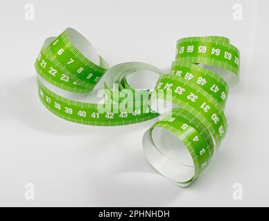 Measuring Tape, Green Measure Tapes, Sewing Metric Tape on White Background Stock Photo