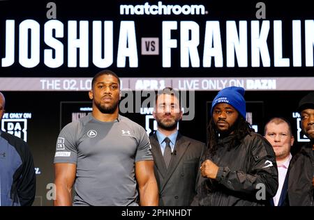 Boxing promoter Eddie Hearn stands in the centre of Anthony Joshua and Jermaine Franklin during a press conference at Nobu Hotel London Portman Square, London. Picture date: Wednesday March 29, 2023. Stock Photo
