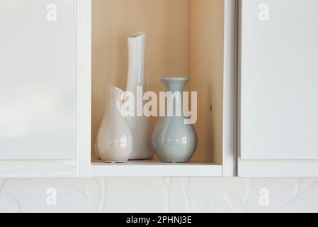 Three vases standing inside of the wall indoors at domestic room Stock Photo