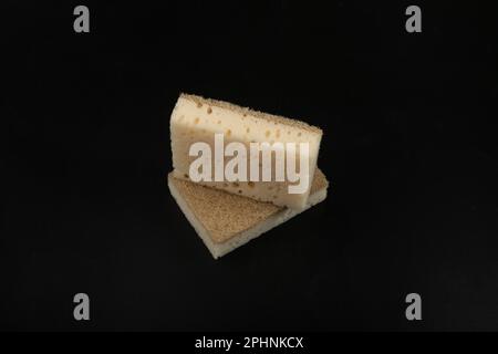 Natural Sponge Isolated on Black, Eco Brown Sponges, Eco Friendly Hygiene Accessory, Scotch Brite Dishwasher on White Background Stock Photo