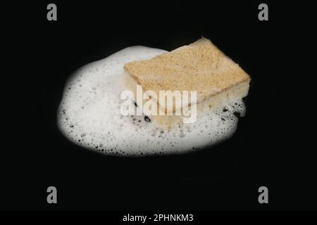 Natural Soapy Sponge with Foam, Eco Brown Sponges, Eco Friendly Hygiene Accessory, Scotch Brite Dishwasher on Black Background Stock Photo
