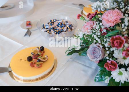 easter table setting with cake and sweets  with cake servers, wedding candy bar Stock Photo