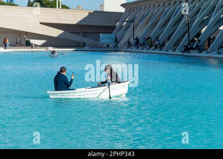 couple of tourists in a rowing boat on the water at the City of Arts and Sciences in valencia, Spain Stock Photo