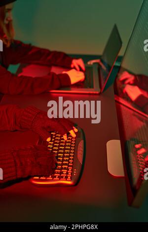 Anonymous people using computer and programming to break code. Cyber security threat. Internet and network security. Access to private information. An Stock Photo