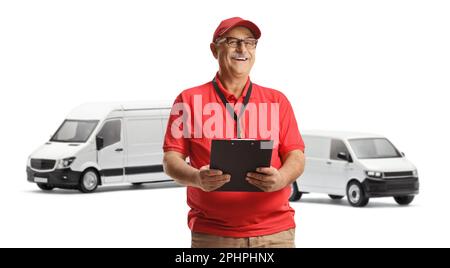 Mature male courier posing in front of white vans isolated on white background Stock Photo