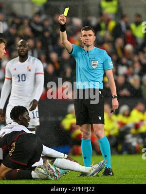 Köln , Germany . 28 March 2023, French referee Willy Delajod pictured showing a yellow card during a friendly soccer game between the national teams of Germany and Belgium , called the Red Devils  , on  Tuesday 28 March 2023  in Köln , Germany . PHOTO SPORTPIX | David Catry Stock Photo