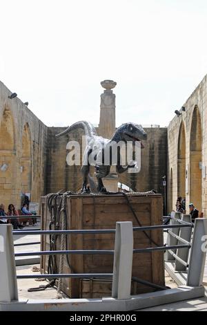 Model of a Velociraptor located in the Upper Barrakka Gardens, Valletta, Malta. Scenes from the 2022 film/movie Jurassic World Dominion were shot in Malta and this dinosaur was on display in the Gardens as part of the Malta Movie Tour which has been home to many movies and films over the years. Stock Photo