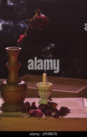 Dried rose and fume photography. Stock Photo