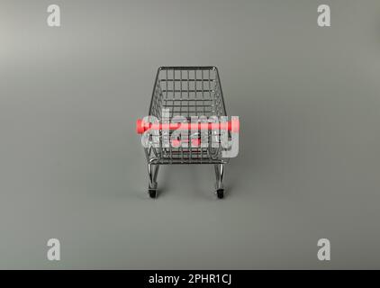 Shopping Basket on Grey Background, Shopping Cart, Shop Cart Mockup, Empty Trolley, Supermarket Cart with Copy Space Stock Photo