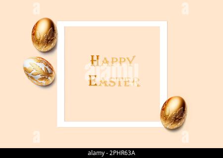 Frame and three easter eggs decorated with gold on pink background. Happy Easter title. Flat lay, top view, copy space. Stock Photo