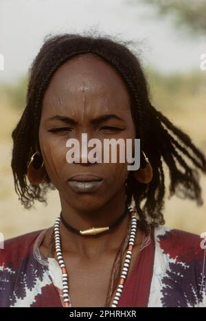 Africa, Sahel region, Chad, Islands of Lake Chad. Buduma boy carrying 