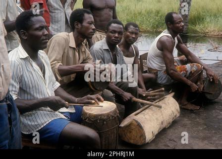 Africa, Democratic Republic of the Congo, Ngiri River area, Libinza tribe. Men playing drums. Stock Photo
