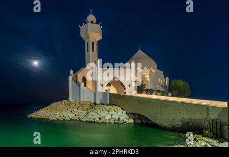 White Salem Bin Laden Mosque built on the island in the moonlight with sea in the background, Al Khobar, Saudi Arabia Stock Photo