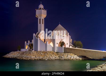 White Salem Bin Laden Mosque built on the island in the night time with sea in the background, Al Khobar, Saudi Arabia Stock Photo