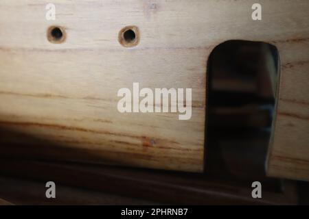 Miniature part of a wooden sailing ship on a desk stand Photo Isolated Stock Photo