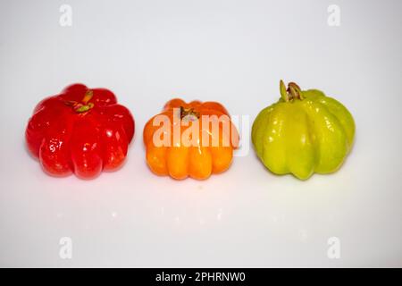 Pitanga fruit (Eugenia uniflora L.), traditional Brazilian wild fruit in selective focus. Stock Photo