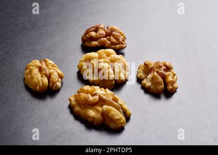 Closeup of walnuts on black background Stock Photo