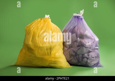 Yellow bags full of plastic waste Stock Photo - Alamy