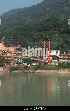 Vertical view of rishikesh ram jhula bridge with mountains and ganga river Stock Photo