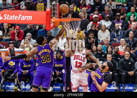 Chicago, USA. 29th Mar, 2023. Chicago, USA, March 29, 2023: Ayo Dosunmu (12 Chicago Bulls) is fouled during the game between the Chicago Bulls and Los Angeles Lakers on Wednesday March 29, 2023 at the United Center, Chicago, USA. (NO COMMERCIAL USAGE) (Shaina Benhiyoun/SPP) Credit: SPP Sport Press Photo. /Alamy Live News Stock Photo
