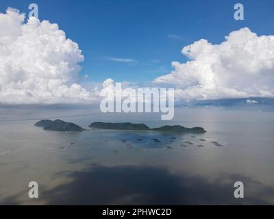 Aerial view blue sunny day at Pulau Aman and Pulau Gedong. Kelong or fish farm at sea Stock Photo