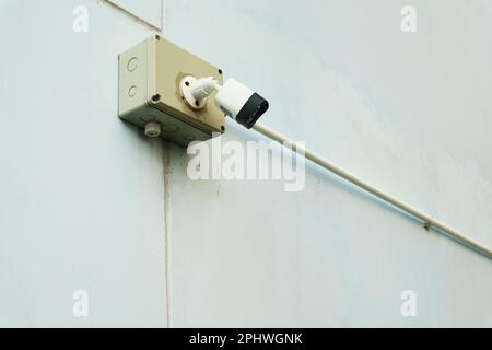 Security Camera on the Outer Wall of a Building Stock Photo