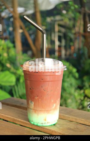 Delectable Iced Mint Chocolate Latte Isolated on Garden Table Stock Photo