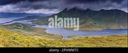 Mount Rugby and Bathurst narrows from Mount Beattie in windy and stormy weather, South west national park, Tasmania, Australia Stock Photo