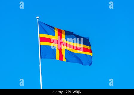 Flag of Aland islands in Finland. Stock Photo