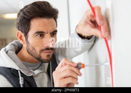 electrician engineer tests electrical installations Stock Photo