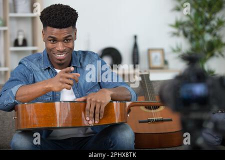 handsome man recording song - vlogging concept Stock Photo