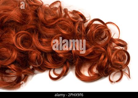 Red hair isolated on a white background. Curly red hair. Stock Photo
