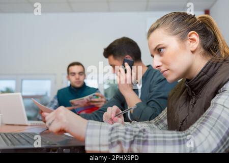 warehouse managers using laptop in warehouse Stock Photo
