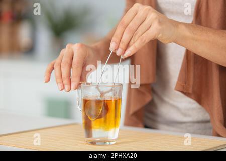 close view of tea infusing into water Stock Photo