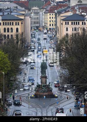 Munich, Germany. 30th Mar, 2023. Cars drive along Maximilianstrasse. According to the city's plans, Max-Joseph-Platz in front of the Bavarian National Theater will become a large, car-free area and Maximilianstraße will be landscaped. Credit: Sven Hoppe/dpa/Alamy Live News Stock Photo