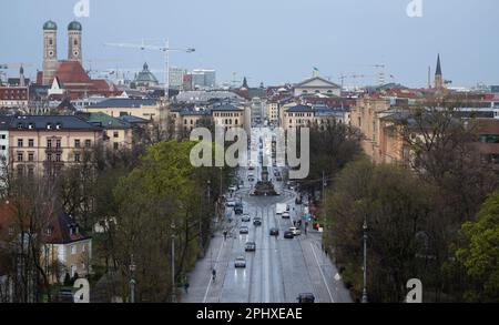 Munich, Germany. 30th Mar, 2023. Cars drive along Maximilianstrasse. According to the city's plans, Max-Joseph-Platz in front of the Bavarian National Theater will become a large, car-free area and Maximilianstraße will be landscaped. Credit: Sven Hoppe/dpa/Alamy Live News Stock Photo