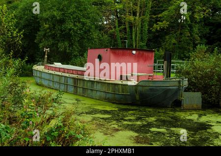 Old restored Lighter barge named Industry on the River Lagan used as a tourist attraction at McCleaves Lock near The Lock Keeper's Cottage Stock Photo