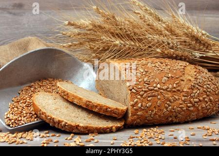 Wheat mix bread with ears of corn Stock Photo