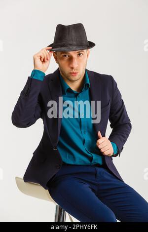 Confident middle-aged wealthy man dressed in retro style suit with hat  Stock Photo - Alamy