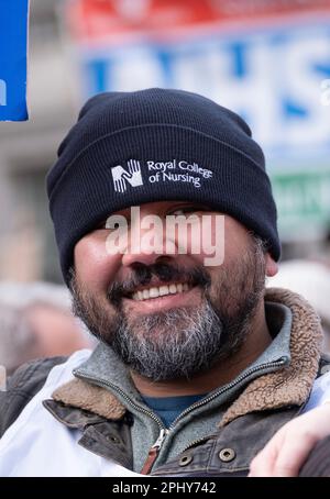 Protester at the SOS NHS National Demo in London, supporting  striking healthcare workers and in protest of the crisis caused by government cuts. Stock Photo