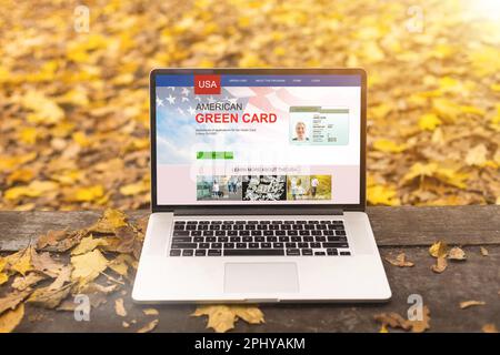 laptop with green cards Application Stock Photo