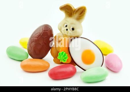 Various sweets and Easter Bunny with eggs Stock Photo