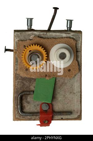 A robotic head made of wood and various small industrial parts isolated on the white background Stock Photo