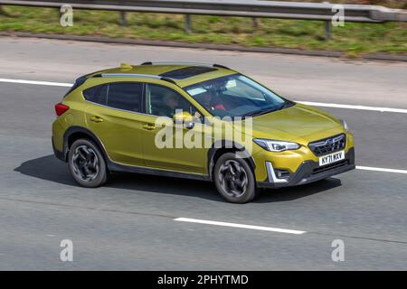 2021 (71) plate Yellow SUBARU XVI SE PREM E BOXER AWD CVT 1995cc Hybrid Electric-traploze automaat parking system; travelling on the M61 motorway, UK Stock Photo