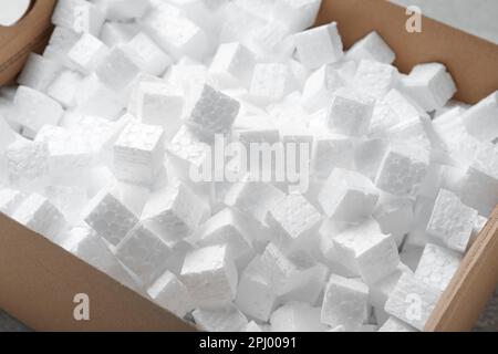 Closeup view of cardboard box with styrofoam cubes Stock Photo