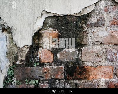 Texture of a brick wall with signs of fire. Stock Photo