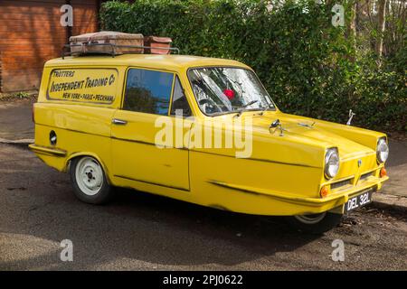 Tribute classic car 'copy' of Del Boy's Reliant Regal (1968 model in the TV series) yellow van from Only Fools and Horses television programme. (133) Stock Photo