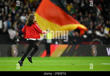 Streaker, fan from Peru in front of Germany flag, Germany flag, international match, MEWA Arena, Mainz, Rhineland-Palatinate, Germany Stock Photo